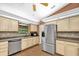 Kitchen with stainless steel appliances, tile backsplash, and wood cabinetry at 1143 131St E St, Bradenton, FL 34212