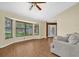 Inviting living room with abundant natural light from the bay window and wood-look flooring at 1143 131St E St, Bradenton, FL 34212