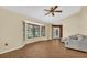 Bright living room featuring large windows, a ceiling fan, and neutral paint at 1143 131St E St, Bradenton, FL 34212