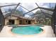 Screened-in pool with a connected hot tub, creating a perfect outdoor oasis at 1143 131St E St, Bradenton, FL 34212