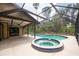Enclosed pool area featuring a hot tub, perfect for outdoor relaxation and enjoyment at 1143 131St E St, Bradenton, FL 34212