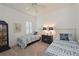 Bright bedroom featuring two twin beds with blue patterned bedding and matching lamps at 12330 Halfmoon Lake Ter, Bradenton, FL 34211
