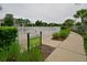 Fenced dog park 'Rover Run' with shade, seating, and greenery for pets and owners at 12330 Halfmoon Lake Ter, Bradenton, FL 34211