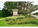 Eagle Trace community entrance sign surrounded by colorful flowers and lush landscaping at 12330 Halfmoon Lake Ter, Bradenton, FL 34211