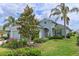 Attractive single-story home featuring a well-maintained lawn, garden and a paved driveway at 12330 Halfmoon Lake Ter, Bradenton, FL 34211