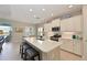 Bright, modern kitchen with large island, stainless steel appliances, and plenty of cabinet space at 12330 Halfmoon Lake Ter, Bradenton, FL 34211