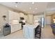 Bright kitchen with large island, stainless steel appliances, and ample cabinet space at 12330 Halfmoon Lake Ter, Bradenton, FL 34211