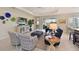 Open-concept living room featuring tile floors, comfortable seating, and TV at 12330 Halfmoon Lake Ter, Bradenton, FL 34211