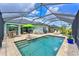 Inviting screened-in pool with beautiful patio furniture, landscaping, and sunny views at 12330 Halfmoon Lake Ter, Bradenton, FL 34211
