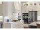 Well-equipped kitchen with stainless steel appliances, a large island, and custom cabinetry with plenty of storage at 12516 Thornhill Ct, Lakewood Ranch, FL 34202