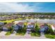 Aerial view of the homes near the lake, showcasing their landscaping at 13422 Flat Woods Ter, Bradenton, FL 34211