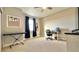 Versatile bedroom with musical instruments, a desk setup, and neutral décor at 13422 Flat Woods Ter, Bradenton, FL 34211