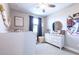 Charming bedroom with a ceiling fan, a dresser, and decor at 13422 Flat Woods Ter, Bradenton, FL 34211