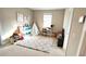Bright bedroom or playroom with carpet, toys, and a view into the Bedroom at 13422 Flat Woods Ter, Bradenton, FL 34211