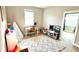 Well-lit bedroom or playroom with carpet, toys, and a sunlit window at 13422 Flat Woods Ter, Bradenton, FL 34211