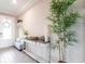 Bright foyer with a console table, bench seating, and a decorative tree at 13422 Flat Woods Ter, Bradenton, FL 34211