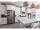 Spacious kitchen with stainless steel appliances, island seating, and ample counter space at 13422 Flat Woods Ter, Bradenton, FL 34211