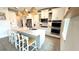 Gourmet kitchen featuring a large island, stainless steel appliances, and contemporary finishes at 13422 Flat Woods Ter, Bradenton, FL 34211
