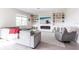 Modern living room with built-in shelving, cozy seating, and a stylish fireplace at 13422 Flat Woods Ter, Bradenton, FL 34211