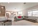 Spacious living area with access to the kitchen and a view of the backyard through large windows at 13422 Flat Woods Ter, Bradenton, FL 34211