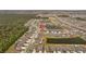 Aerial view of a neighborhood with a pond and lush green trees with a birds eye view at 13422 Willow Bluestar Loop, Riverview, FL 33579