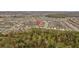 Aerial view of a community with several ponds surrounded by green trees on a sunny day at 13422 Willow Bluestar Loop, Riverview, FL 33579