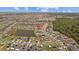 Aerial view of a community with several ponds surrounded by green trees and lush trees on a sunny day at 13422 Willow Bluestar Loop, Riverview, FL 33579