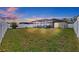 A spacious backyard with a screened patio, perfect for outdoor entertaining and relaxation at 13422 Willow Bluestar Loop, Riverview, FL 33579