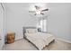 Cozy bedroom featuring a ceiling fan, neutral tones, and comfortable furnishings at 13422 Willow Bluestar Loop, Riverview, FL 33579