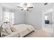 Relaxing bedroom with a ceiling fan, natural light, and a soothing color scheme at 13422 Willow Bluestar Loop, Riverview, FL 33579