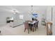 Open concept dining area with views into the living room and sliding door to the outside at 13422 Willow Bluestar Loop, Riverview, FL 33579