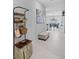 Welcoming entryway featuring a stylish coat rack and bench with art on the wall at 13422 Willow Bluestar Loop, Riverview, FL 33579