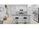 Modern kitchen featuring white cabinets, granite countertops, and stainless steel appliances at 13422 Willow Bluestar Loop, Riverview, FL 33579