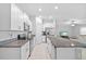 Bright kitchen features granite counters, stainless steel appliances, and white cabinets at 13422 Willow Bluestar Loop, Riverview, FL 33579