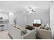 The home has an open concept living area with views into the kitchen and dining areas at 13422 Willow Bluestar Loop, Riverview, FL 33579