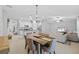 Spacious living spaces are open to the kitchen and dining areas of the home at 13422 Willow Bluestar Loop, Riverview, FL 33579