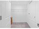 A walk-in closet with carpet flooring, a wire rack shelf, and a small set of drawers at 13422 Willow Bluestar Loop, Riverview, FL 33579