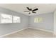 Serene bedroom with two windows for ample natural light and a modern ceiling fan for added comfort at 1364 Westport Ln # 1403, Sarasota, FL 34232