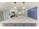 The kitchen features a spacious island with granite countertops, stainless steel appliances, and ample cabinet space at 1364 Westport Ln # 1403, Sarasota, FL 34232