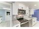 Bright kitchen featuring stainless steel appliances, modern countertops, and open layout at 1364 Westport Ln # 1403, Sarasota, FL 34232