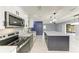 Modern kitchen featuring stainless steel appliances, granite countertops, and an island for extra seating and prep space at 1364 Westport Ln # 1403, Sarasota, FL 34232