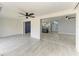 Open living room showcasing sleek tile flooring and a view into the updated kitchen, perfect for modern living at 1364 Westport Ln # 1403, Sarasota, FL 34232