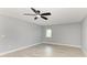Bright bedroom featuring a ceiling fan, neutral paint, and tile flooring, creating a serene and comfortable space at 1364 Westport Ln # 1403, Sarasota, FL 34232