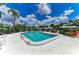 Sparkling community pool with lounge chairs for relaxation at 1364 Westport Ln # 1403, Sarasota, FL 34232
