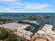 Breathtaking aerial view of waterfront condominium community with boat docks and ocean views at 14041 Bellagio Way # 218, Osprey, FL 34229