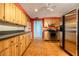 Efficient kitchen with wooden cabinets, stainless steel appliances, and tile flooring at 1434 Beacon Dr, Port Charlotte, FL 33952