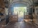The inside of this barn features a dirt floor and a wooden gate at 15308 Fruitville Rd, Sarasota, FL 34240