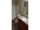 Bathroom with a shower and a toilet with wooden seat at 15308 Fruitville Rd, Sarasota, FL 34240