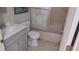 A bathroom features a swan etched shower door, a sink with cabinet, and tile floors at 15308 Fruitville Rd, Sarasota, FL 34240
