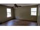 Spacious bedroom with ceiling fan and wood-look flooring, offering comfort and style at 15308 Fruitville Rd, Sarasota, FL 34240
